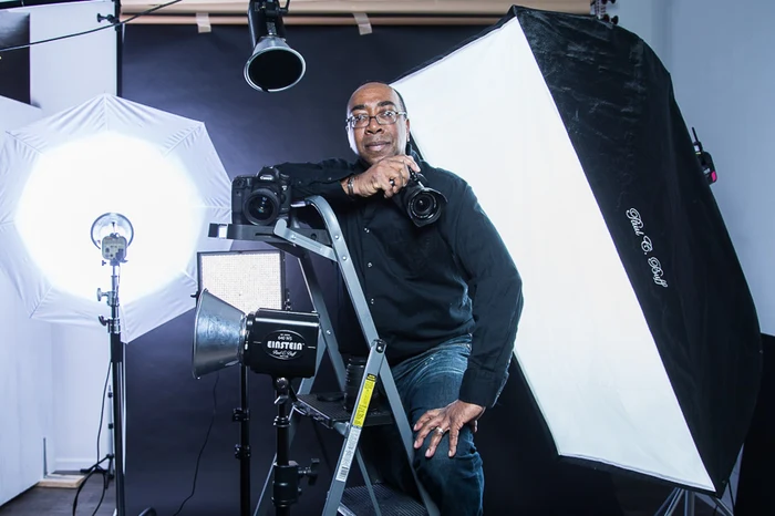 Marvin Hall in his Lansing studio, camera in hand